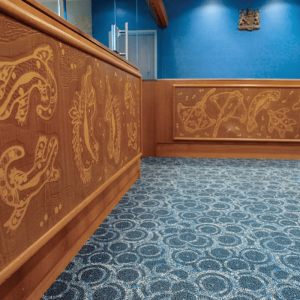 Laser engraved Aboriginal artwork on 12 metres of solid timber panels for a magistrate's bench and wall art at Palm Island