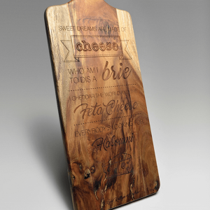 Laser engraved artwork into a timber cheese board making it an amusing and customised wedding gift.